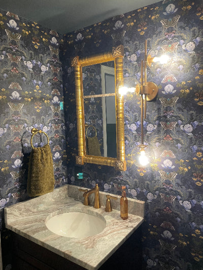 Bathroom with ornate gold mirror and Bloomsbury Moth wallpaper | APRIL MAWHINNEY ILLUSTRATION